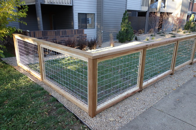 Wood-framed wire mesh fence with set posts built by Liberty Fence